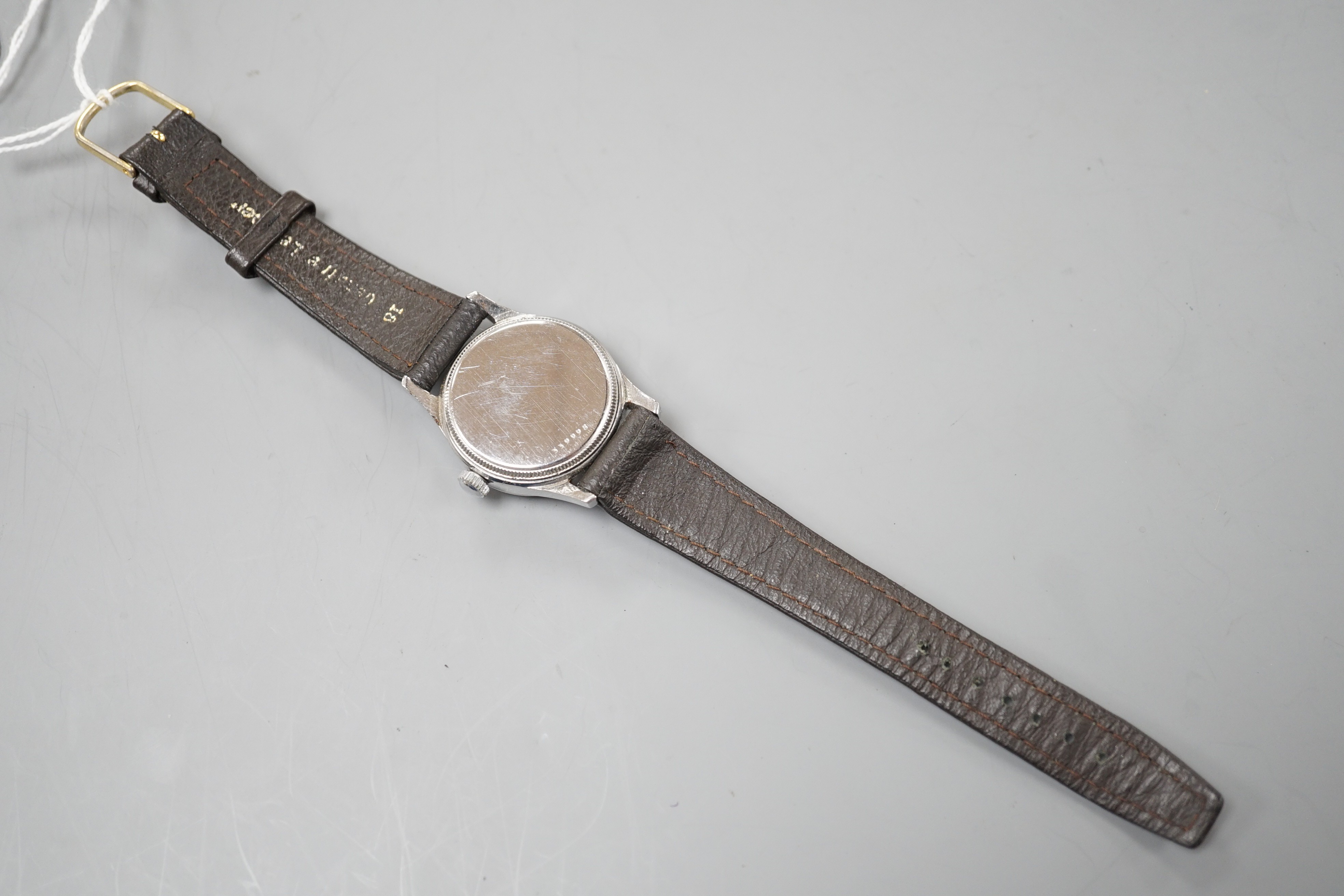 A gentleman's mid 20th century stainless steel Tudor Oyster manual wind wrist watch, with baton and Arabic dial, on later associated leather strap.